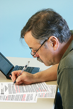 photo of man filling out form