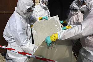 contractors removing asbestos from a building