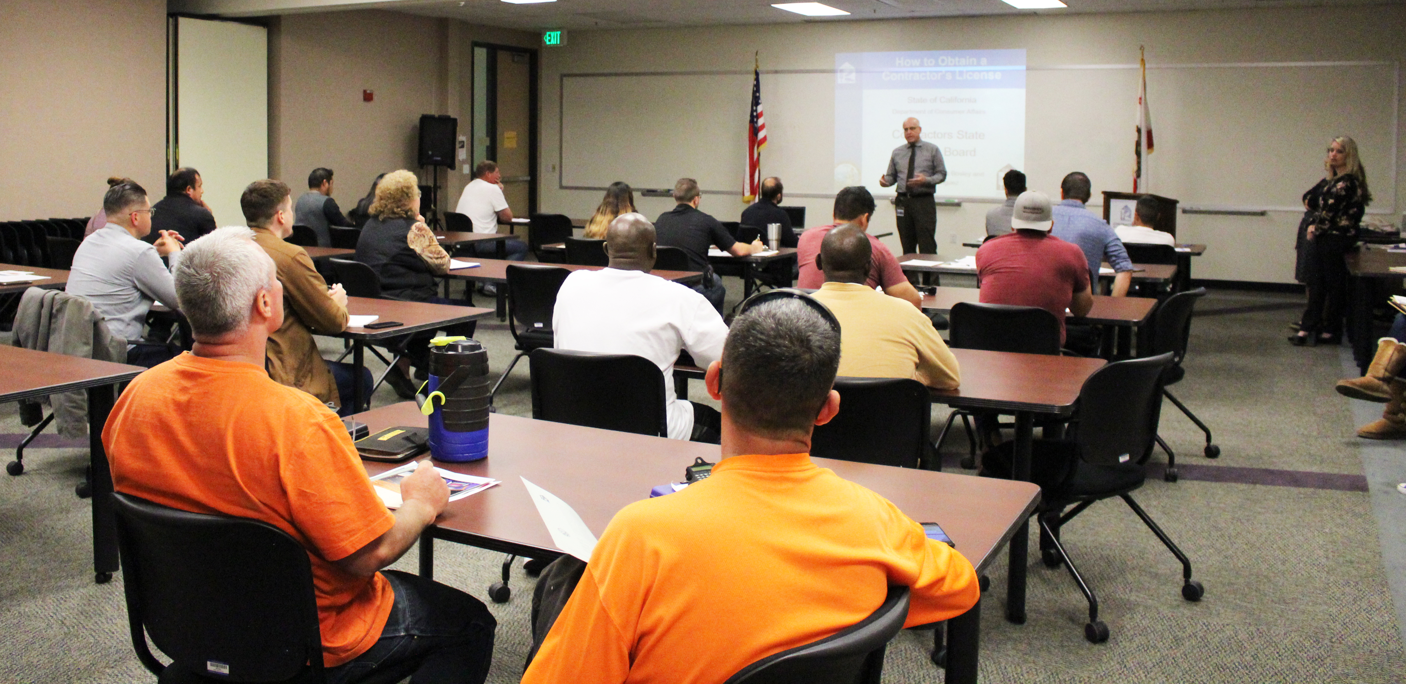 photo of conference room with perspective contractors listening to a speaker on how to get a license